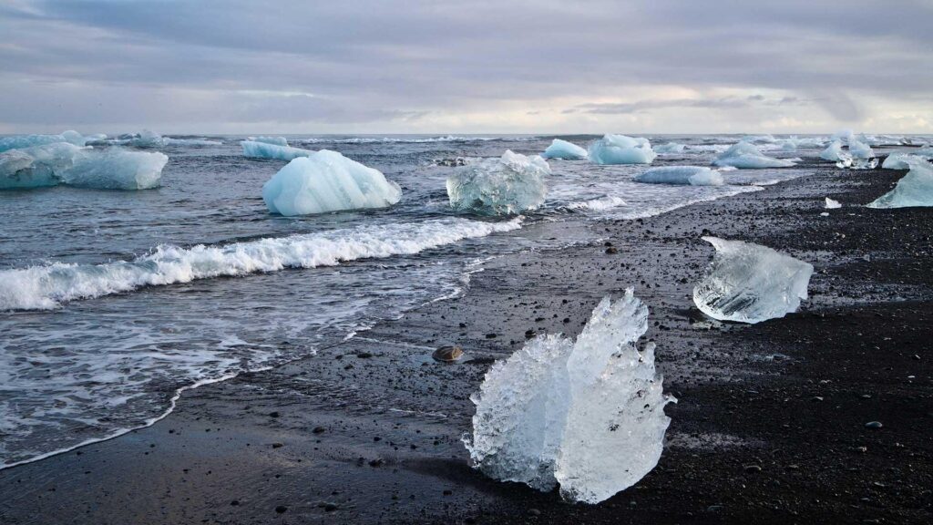 Diamond Beach in Iceland with black sand and sparkling glacier ice